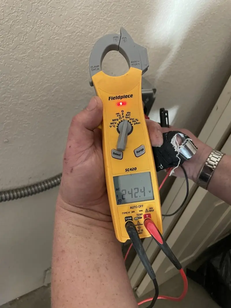 Voltage testing with clamp meter during Generator Installation in Ipswich